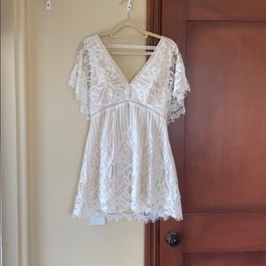 white loose flows dress, deep v and backless